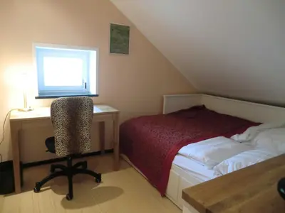 Ein Bett oder Betten in einem Zimmer der Unterkunft maisonette
