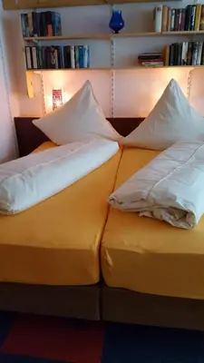 Ein Bett oder Betten in einem Zimmer der Unterkunft Ferienwohnung Roch GbR