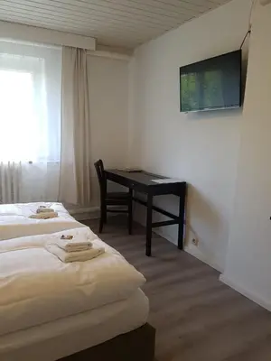 Ein Bett oder Betten in einem Zimmer der Unterkunft Pension New Nomads