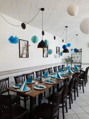 Ein Restaurant oder anderes Speiselokal in der Unterkunft Pension New Nomads