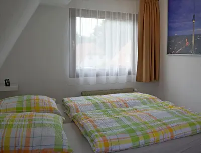 Ein Bett oder Betten in einem Zimmer der Unterkunft Ferienwohnung Teltow 2