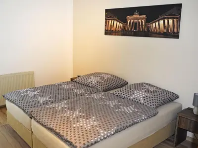 Ein Bett oder Betten in einem Zimmer der Unterkunft Ferienwohnung Teltow 2
