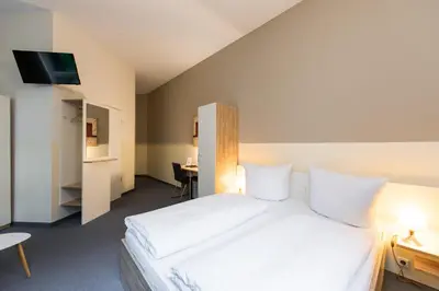 Ein Bett oder Betten in einem Zimmer der Unterkunft Nu Wave Hotel Berlin - Digital Check-In
