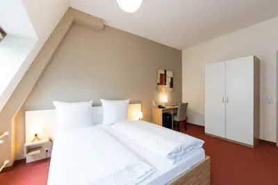 Ein Bett oder Betten in einem Zimmer der Unterkunft Nu Wave Hotel Berlin - Digital Check-In
