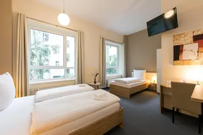 Ein Bett oder Betten in einem Zimmer der Unterkunft Nu Wave Hotel Berlin - Digital Check-In