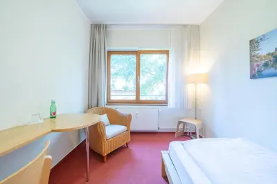 Ein Bett oder Betten in einem Zimmer der Unterkunft Hotel 26