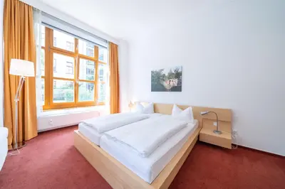 Ein Bett oder Betten in einem Zimmer der Unterkunft Hotel 26