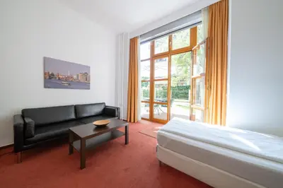 Ein Bett oder Betten in einem Zimmer der Unterkunft Hotel 26