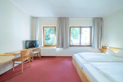 Ein Bett oder Betten in einem Zimmer der Unterkunft Hotel 26