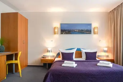 Ein Bett oder Betten in einem Zimmer der Unterkunft Hotel Ambiente Berlin City