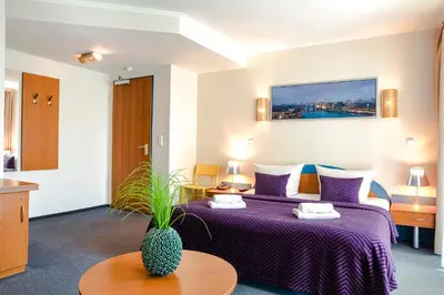 Ein Bett oder Betten in einem Zimmer der Unterkunft Hotel Ambiente Berlin City