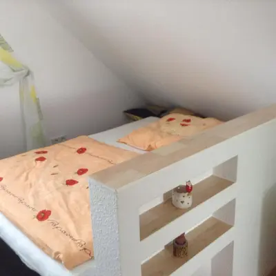 Ein Bett oder Betten in einem Zimmer der Unterkunft Eulennest Oranienburg