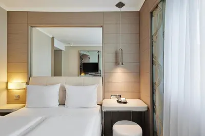 Ein Bett oder Betten in einem Zimmer der Unterkunft TITANIC Comfort Mitte