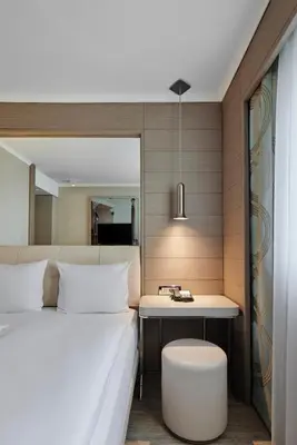 Ein Bett oder Betten in einem Zimmer der Unterkunft TITANIC Comfort Mitte