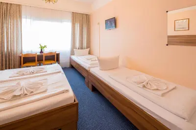 Ein Bett oder Betten in einem Zimmer der Unterkunft Alper Hotel am Potsdamer Platz