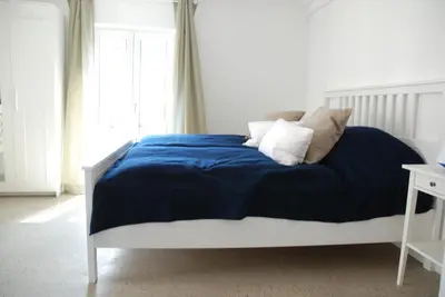 Ein Bett oder Betten in einem Zimmer der Unterkunft Remise am Schlosspark