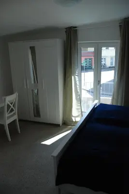 Ein Bett oder Betten in einem Zimmer der Unterkunft Remise am Schlosspark