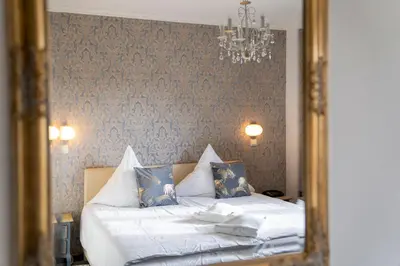Ein Bett oder Betten in einem Zimmer der Unterkunft Hotel Am Wald B&B
