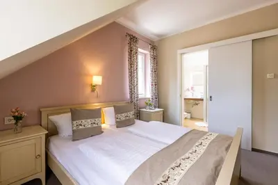 Ein Bett oder Betten in einem Zimmer der Unterkunft Café Wildau Hotel & Restaurant am Werbellinsee