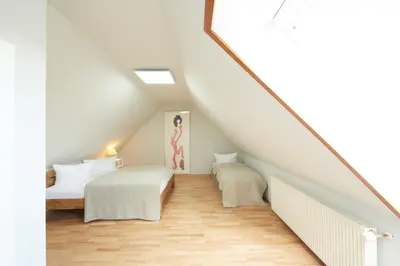 Ein Bett oder Betten in einem Zimmer der Unterkunft Hotel garni 