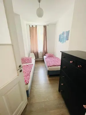 Ein Bett oder Betten in einem Zimmer der Unterkunft Nice City Apartment