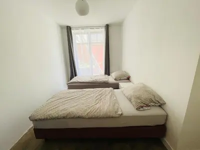 Ein Bett oder Betten in einem Zimmer der Unterkunft Zentrale ruhige Ferienwohnung in Berlin