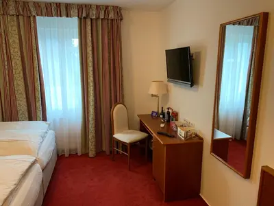 Ein Bett oder Betten in einem Zimmer der Unterkunft Gästehaus Alpinia