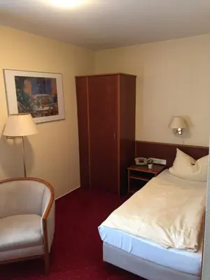 Ein Bett oder Betten in einem Zimmer der Unterkunft Gästehaus Alpinia