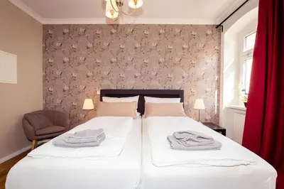 Ein Bett oder Betten in einem Zimmer der Unterkunft Ferienwohnung Gründerhaus