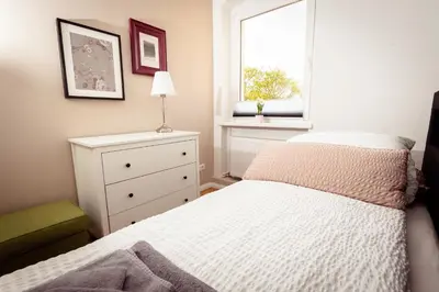 Ein Bett oder Betten in einem Zimmer der Unterkunft Ferienwohnung Gründerhaus