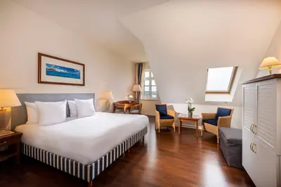 Ein Bett oder Betten in einem Zimmer der Unterkunft Sunday Resort Schwielowsee - Hotel