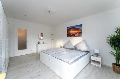 Ein Bett oder Betten in einem Zimmer der Unterkunft Grand Appartement nahe Müggelsee
