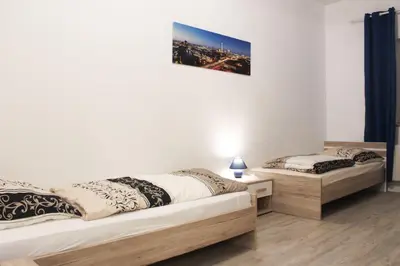 Ein Bett oder Betten in einem Zimmer der Unterkunft Grand Appartement nahe Müggelsee