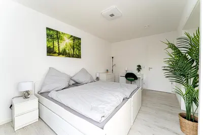 Ein Bett oder Betten in einem Zimmer der Unterkunft Grand Appartement nahe Müggelsee