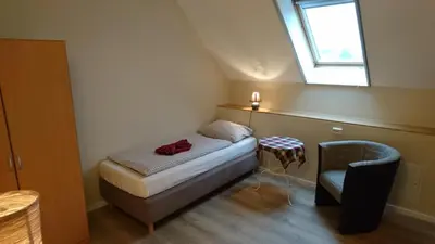 Ein Bett oder Betten in einem Zimmer der Unterkunft Gasthaus Zur Hecke