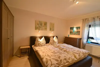 Ein Bett oder Betten in einem Zimmer der Unterkunft Ferienwohnungen Schön