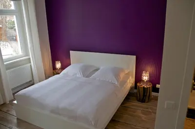 Ein Bett oder Betten in einem Zimmer der Unterkunft Jaspers Boutique Rooms