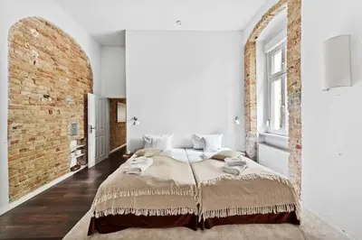 Ein Bett oder Betten in einem Zimmer der Unterkunft Arbio I Rustic Loft in Reuterkiez