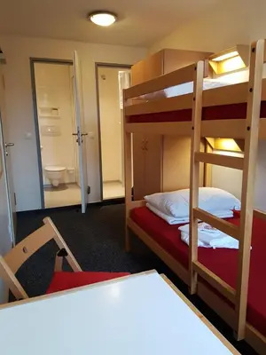 Ein Bett oder Betten in einem Zimmer der Unterkunft CVJM Jugendgästehaus Berlin