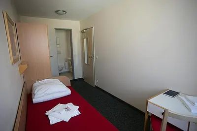 Ein Bett oder Betten in einem Zimmer der Unterkunft CVJM Jugendgästehaus Berlin