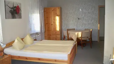 Ein Bett oder Betten in einem Zimmer der Unterkunft Ferienappartements Am Weinberg