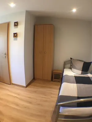 Ein Bett oder Betten in einem Zimmer der Unterkunft Pension im Grünen