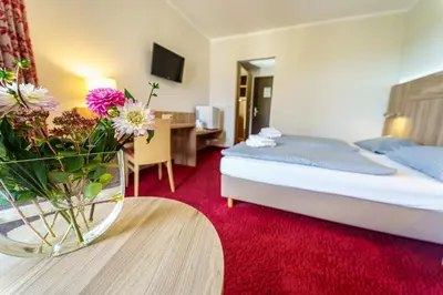 Ein Bett oder Betten in einem Zimmer der Unterkunft Einklang - Dein Hotel am Südhorn