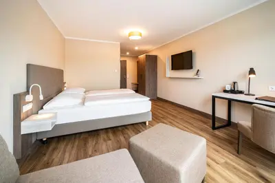 Ein Bett oder Betten in einem Zimmer der Unterkunft Hotel Spree-idyll