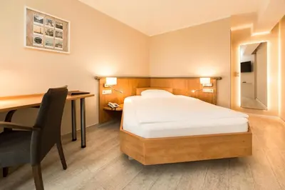 Ein Bett oder Betten in einem Zimmer der Unterkunft Hotel Spree-idyll