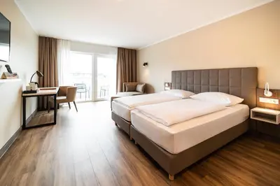 Ein Bett oder Betten in einem Zimmer der Unterkunft Hotel Spree-idyll