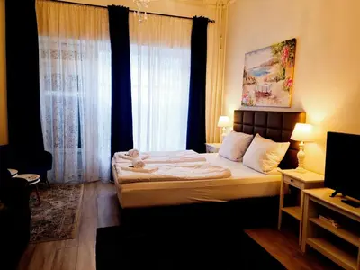 Ein Bett oder Betten in einem Zimmer der Unterkunft City Apartment, good location
