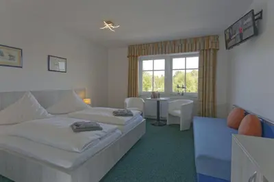 Ein Bett oder Betten in einem Zimmer der Unterkunft Neu-Helgoland