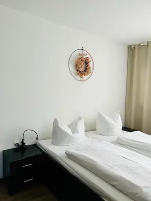 Ein Bett oder Betten in einem Zimmer der Unterkunft Hotel My Schildow