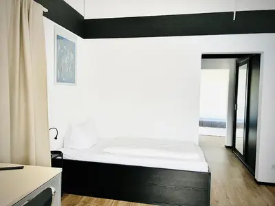 Ein Bett oder Betten in einem Zimmer der Unterkunft Hotel My Schildow